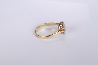 Lot 20 - An 18 carat yellow gold diamond cluster ring,...
