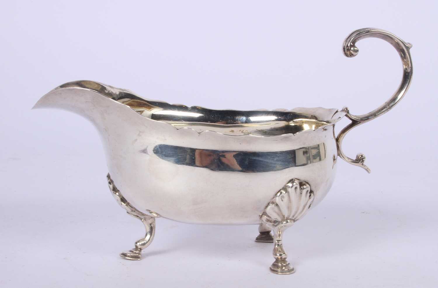 Lot 49 - A Victorian silver helmet shaped sauce boat,...