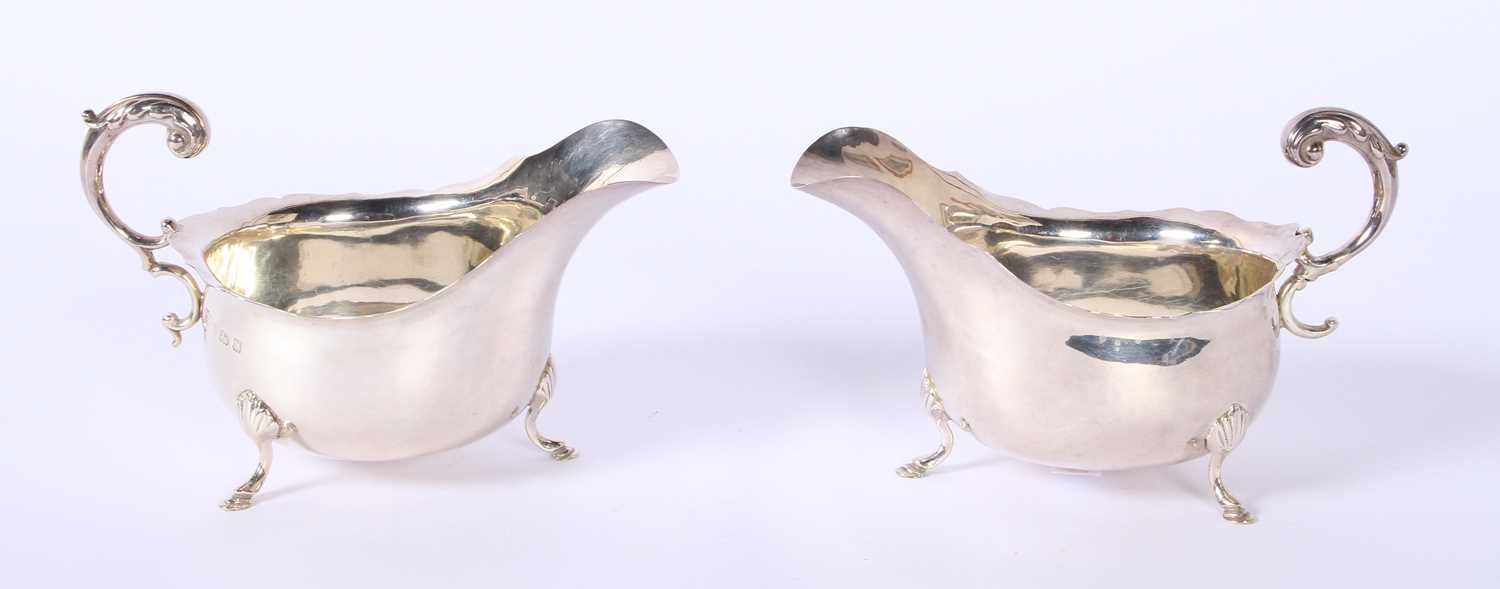 Lot 36 - A pair of George V silver helmet shaped sauce...