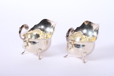 Lot 36 - A pair of George V silver helmet shaped sauce...