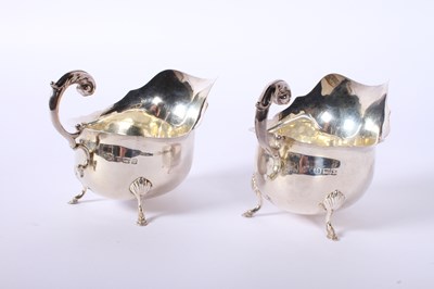 Lot 36 - A pair of George V silver helmet shaped sauce...
