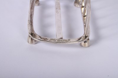 Lot 45 - A George VI silver four division toast rack,...