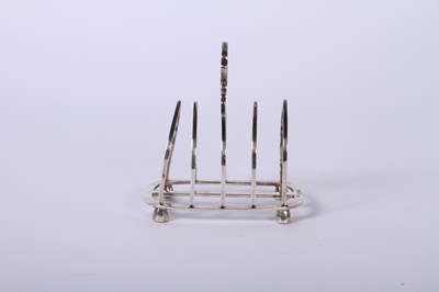 Lot 45 - A George VI silver four division toast rack,...