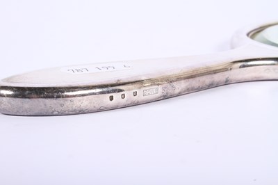 Lot 46 - A George V silver-backed six piece dressing...