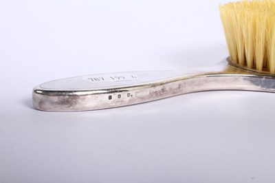 Lot 46 - A George V silver-backed six piece dressing...
