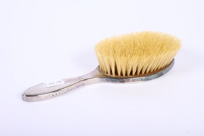 Lot 46 - A George V silver-backed six piece dressing...