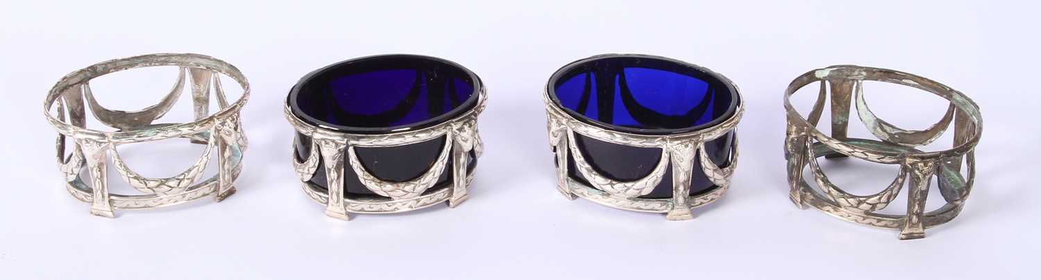 Lot 31 - A set of four George IV silver salts, each...
