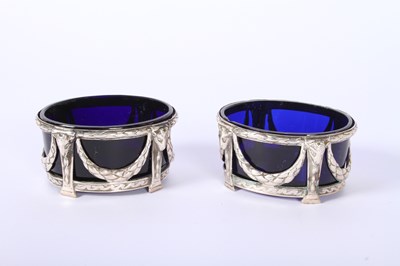Lot 31 - A set of four George IV silver salts, each...