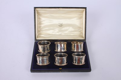 Lot 55 - A set of six silver napkin rings, marks rubbed,...