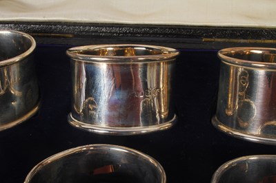 Lot 55 - A set of six silver napkin rings, marks rubbed,...