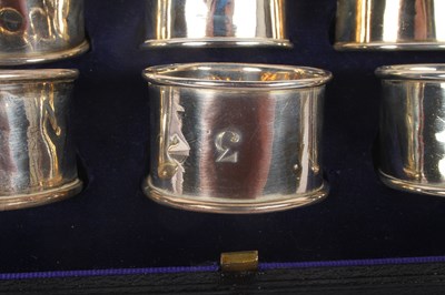Lot 55 - A set of six silver napkin rings, marks rubbed,...
