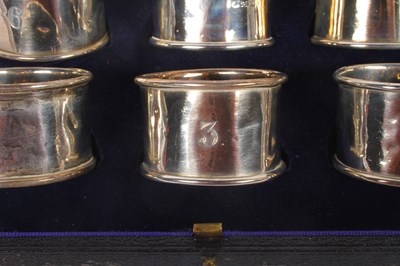 Lot 55 - A set of six silver napkin rings, marks rubbed,...