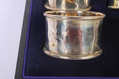 Lot 55 - A set of six silver napkin rings, marks rubbed,...