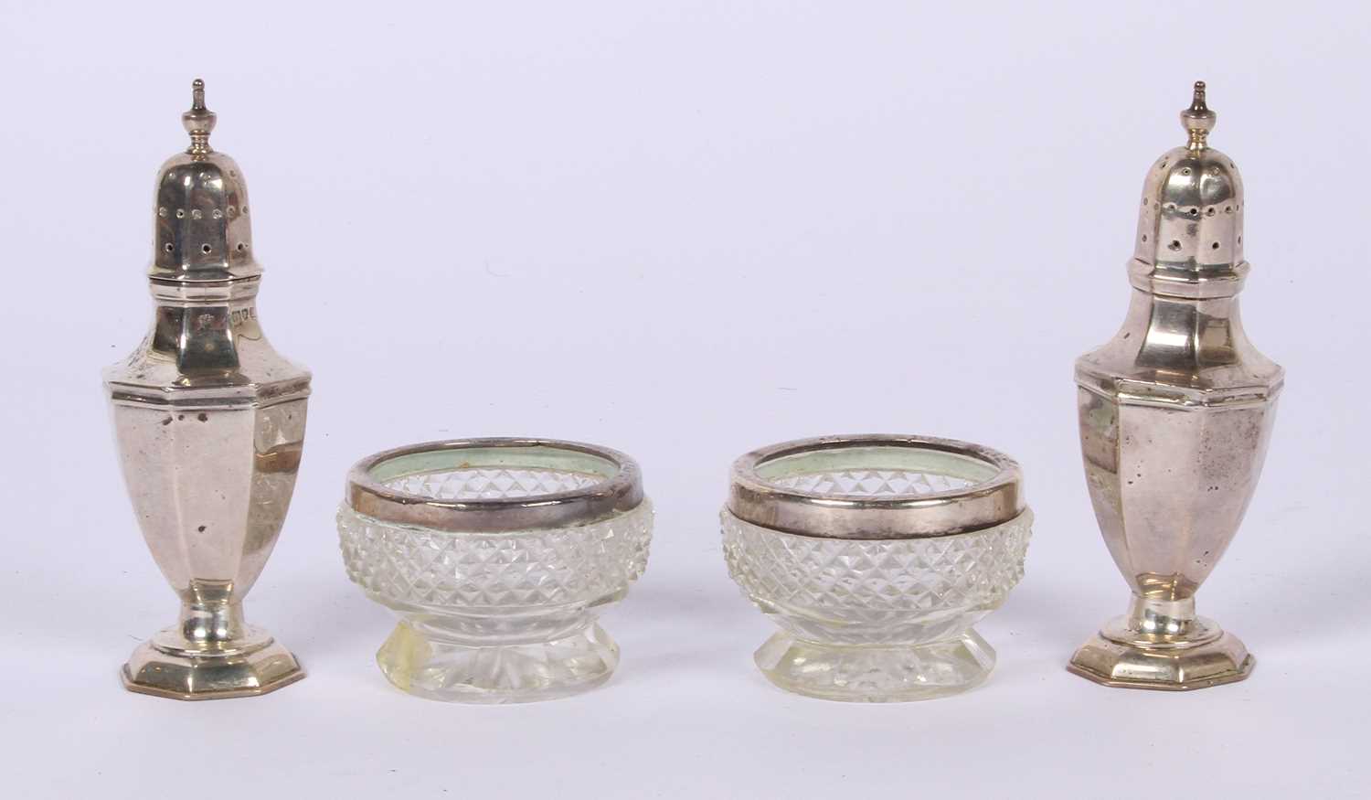 Lot 75 - A pair of George V silver peppers, London 1927,...