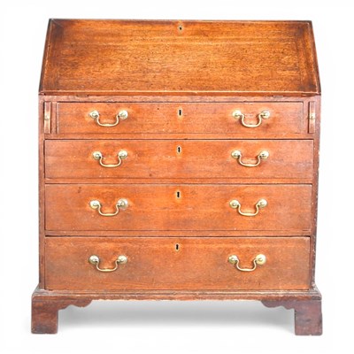 Lot 717 - A George III mahogany bureau, on bracket feet