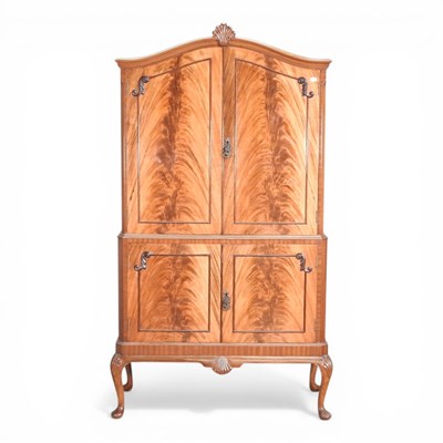Lot 741 - A mid 20th century cocktail cabinet, with a...