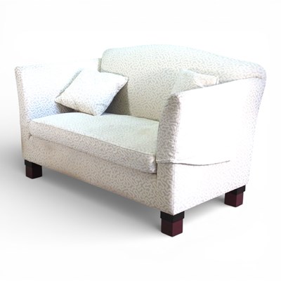 Lot 573 - A modern cream upholstered two seater sofa,...