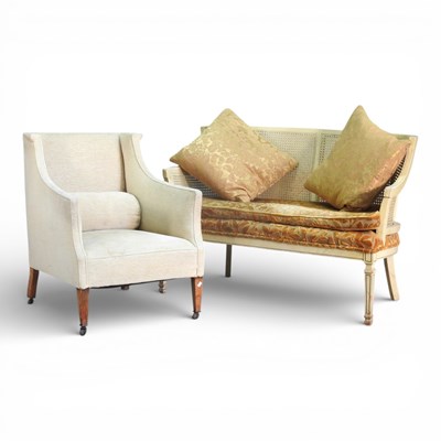 Lot 248 - A French style cream painted bergere sofa,...