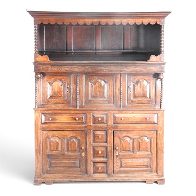 Lot 598 - An 18th century Welsh oak tridarn, having a...