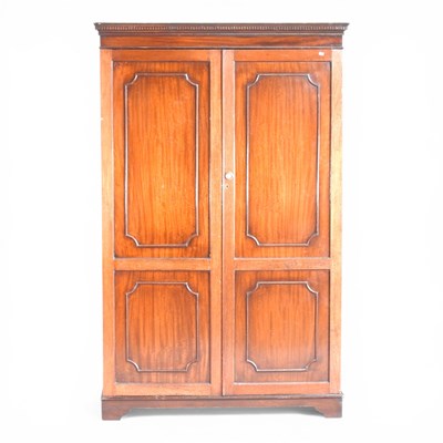 Lot 675 - An early 20th century mahogany double wardrobe,...