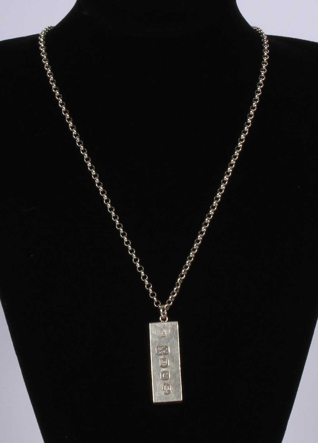 Lot 63 - A silver ingot on a long chain necklace, 50g...