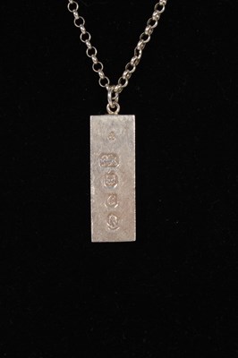 Lot 63 - A silver ingot on a long chain necklace, 50g...