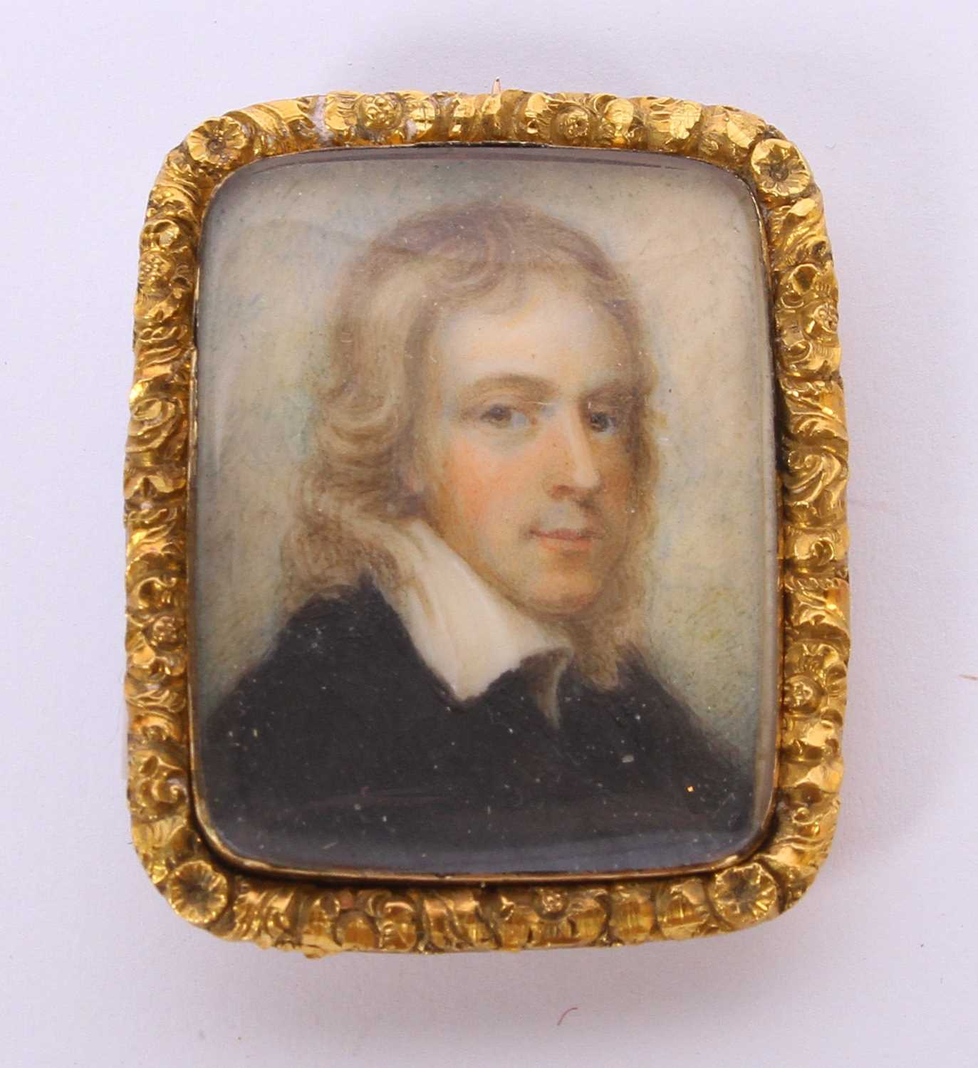 Lot 4 - A 19th century miniature portrait brooch, set...