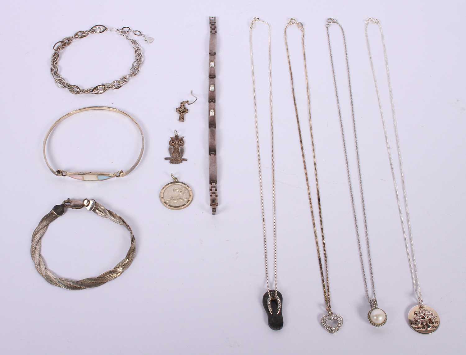 Lot 73 - A collection of silver and white metal jewelry...