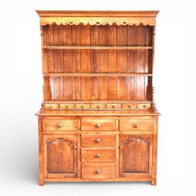Lot 503 - A modern oak dresser, the boarded back with...
