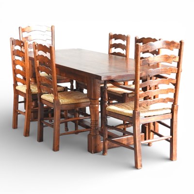 Lot 685 - A modern oak refectory dining table, together...