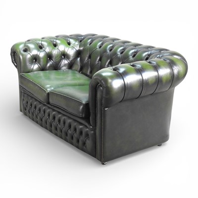 Lot 193 - A green leather button back chesterfield sofa,...