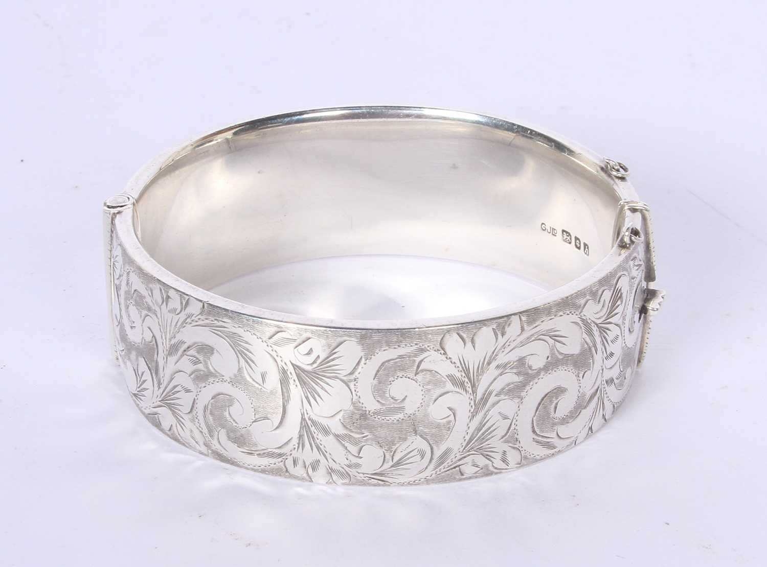Lot 52 - A George Jensen silver hinged bangle with...