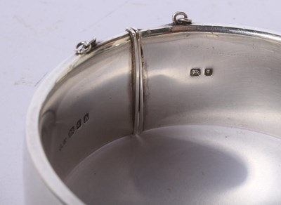 Lot 52 - A George Jensen silver hinged bangle with...