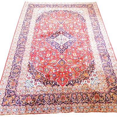 Lot 582 - A Persian kashan carpet, with scrolling...