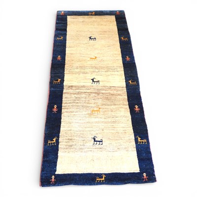 Lot 348 - A Persian Gabeh pictorial runner, decorated...