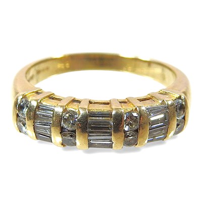 Lot 81 - An 18 carat gold half hoop eternity ring, set...