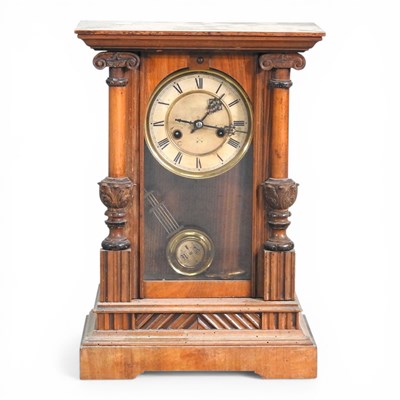 Lot 540 - A 19th century walnut cased mantel clock, 45cm...