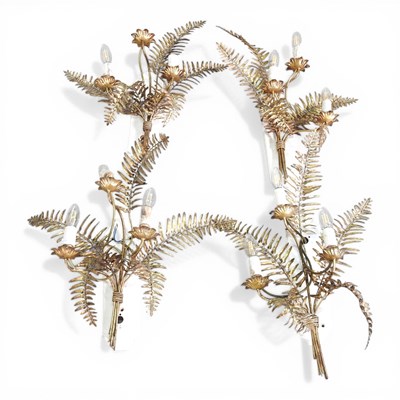Lot 501 - A collection of four gilt metal wall lights,...