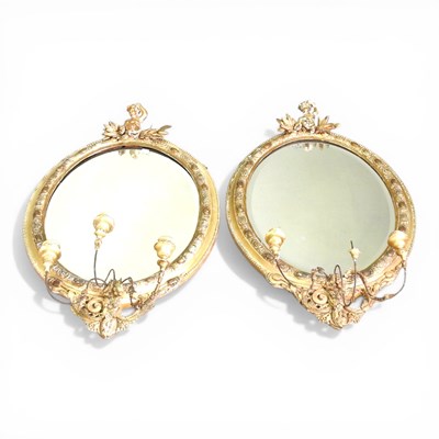 Lot 497 - A pair of 19th century gilt gesso framed oval...