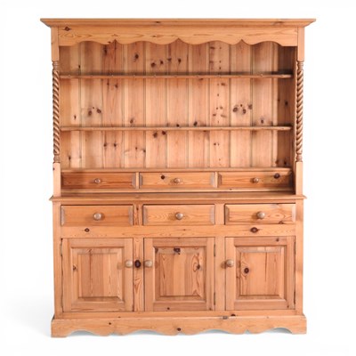 Lot 162 - A modern pine dresser, having a boarded back,...