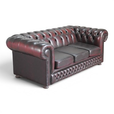 Lot 104 - A modern maroon leather upholstered...