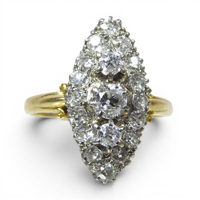Lot 36 - An 18 carat gold and diamond cluster ring, of...