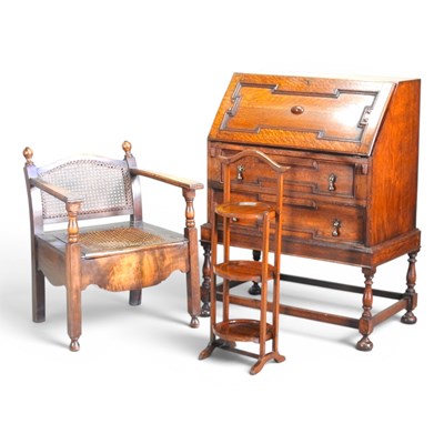 Lot 733 - A 1920s cane chair, together with a 1920s oak...