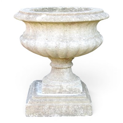 Lot 93 - A cast stone garden urn, of pedestal form,...