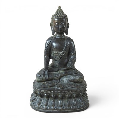 Lot 148 - An Asian patinated bronze figure of Buddha,...