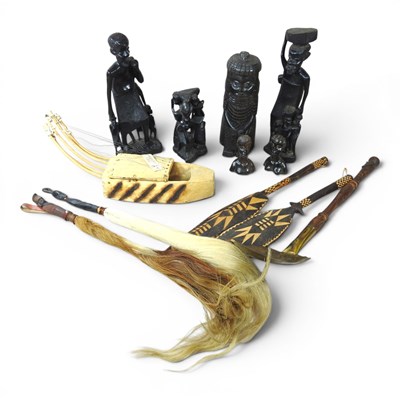 Lot 340 - A collection of African carved figures, to...