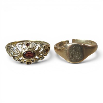 Lot 121 - A 9 carat gold garnet dress ring, of openwork...