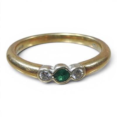 Lot 207 - A 9 carat gold, emerald and diamond three...