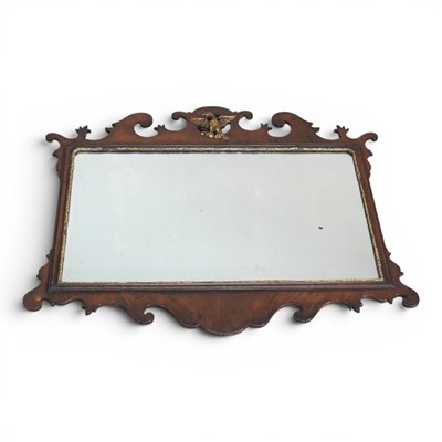 Lot 580 - An Edwardian mahogany fret carved wall mirror,...