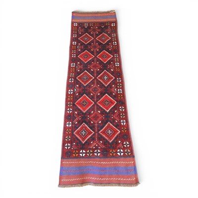 Lot 387 - A Persian kilim runner, with two rows of...